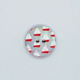 Plastikknap med sejlskibe